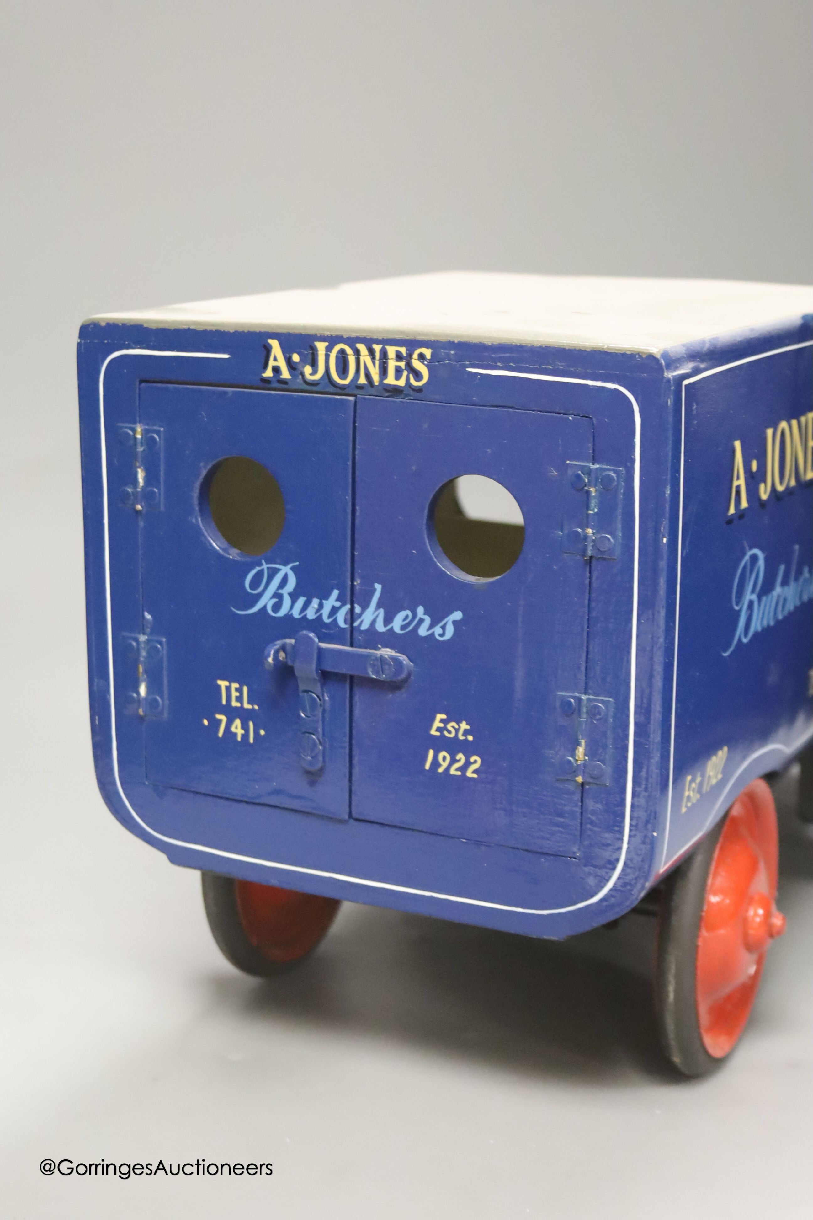 An A. Jones Butcher's painted metal model of a van, length 47cm height 25cm